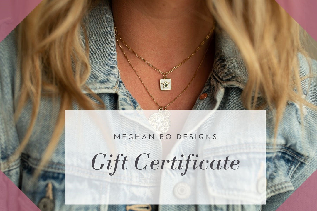 A woman with blonde hair is wearing layered necklaces with a star made by Meghan Bo Designs.